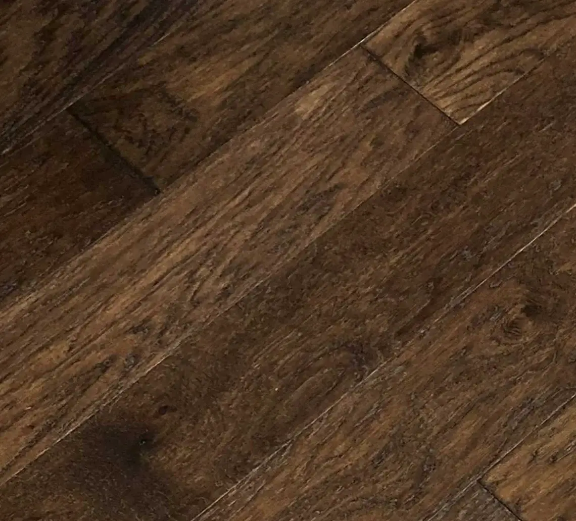 Close-up of engineered hardwood floor showing beveled plank edges and visible seams